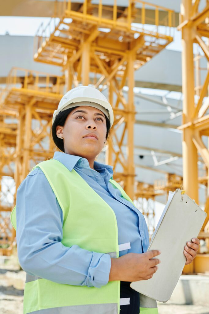 Female construction manager inspecting work.